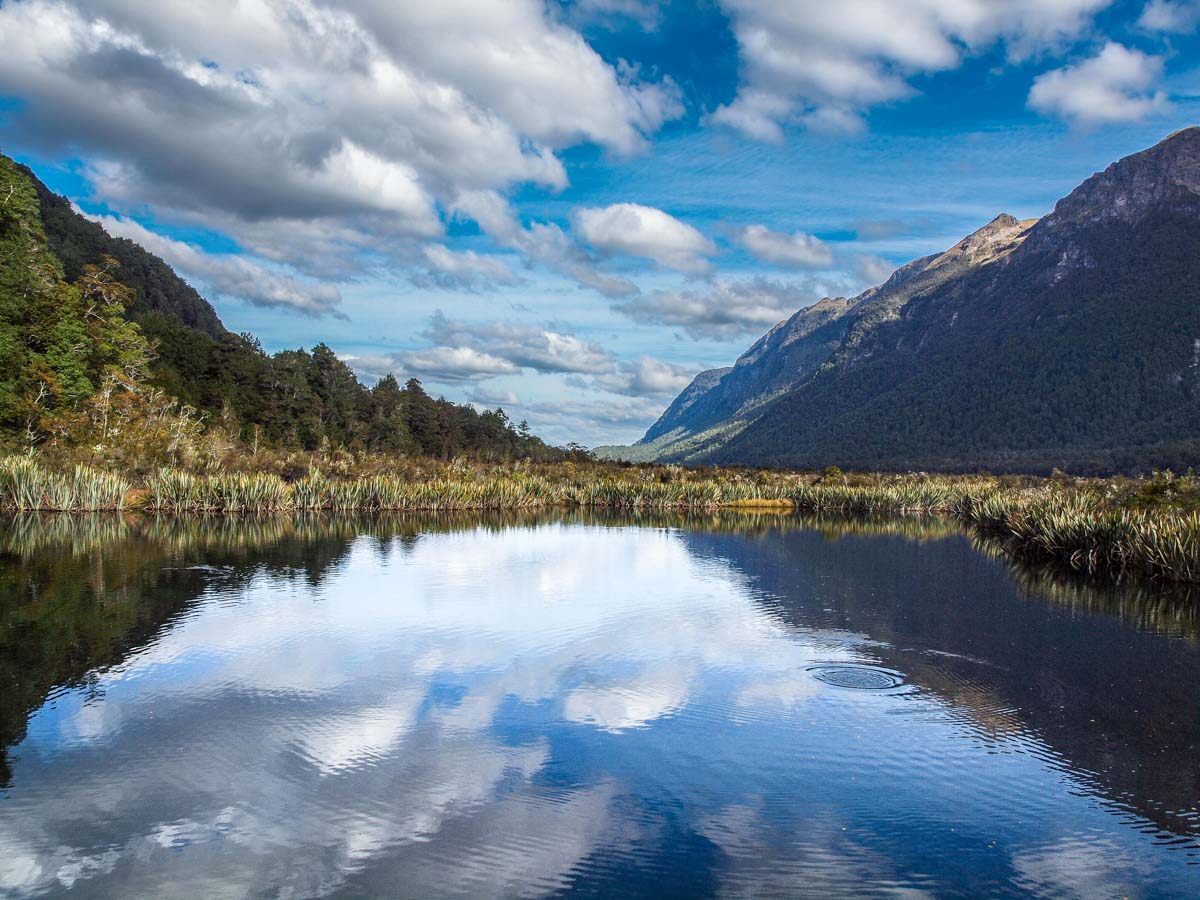 mountain lake with reflections symbolizing reflection and rediscovery in retirement.